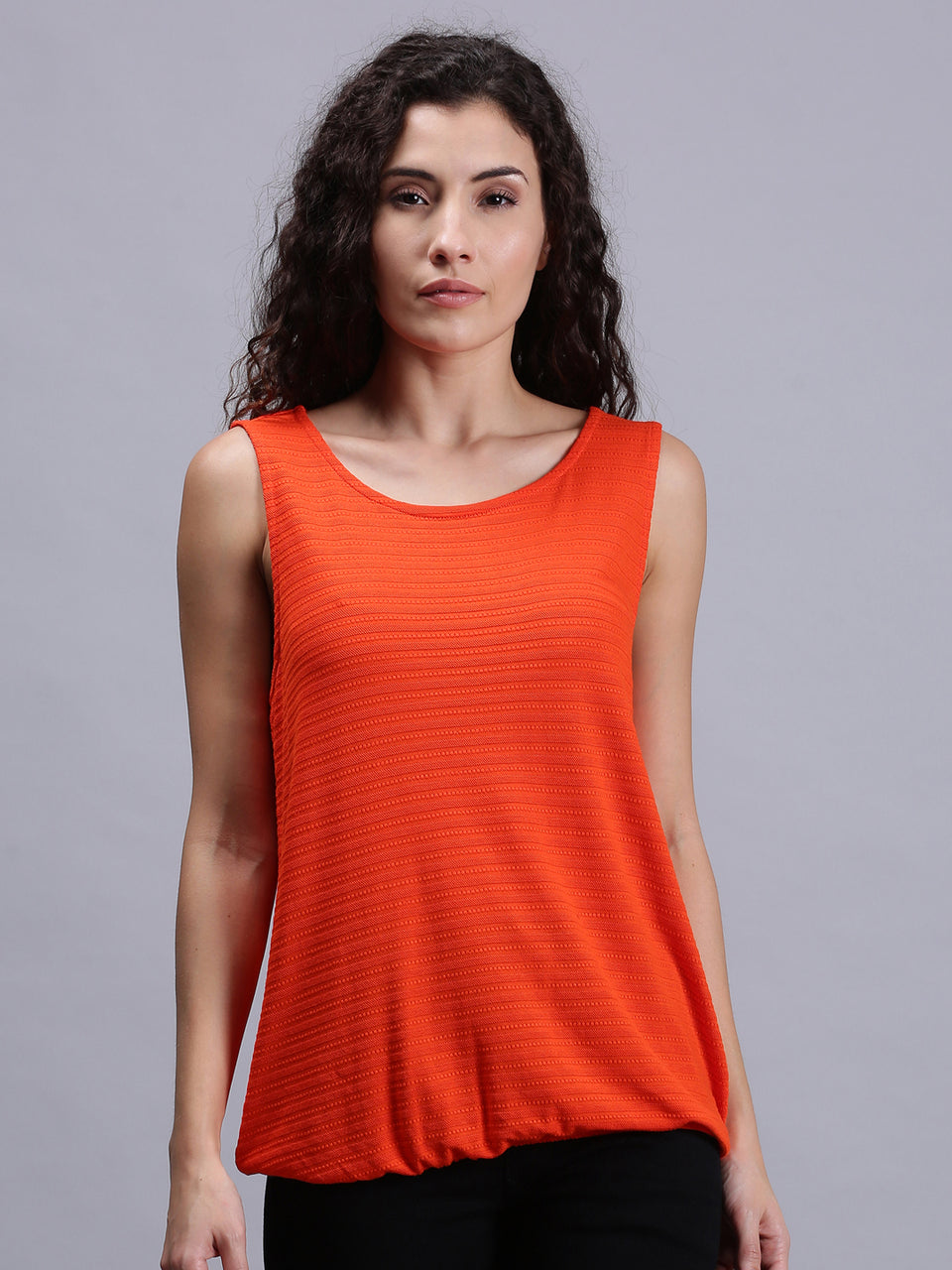 women solid orange sleeveless tank tops