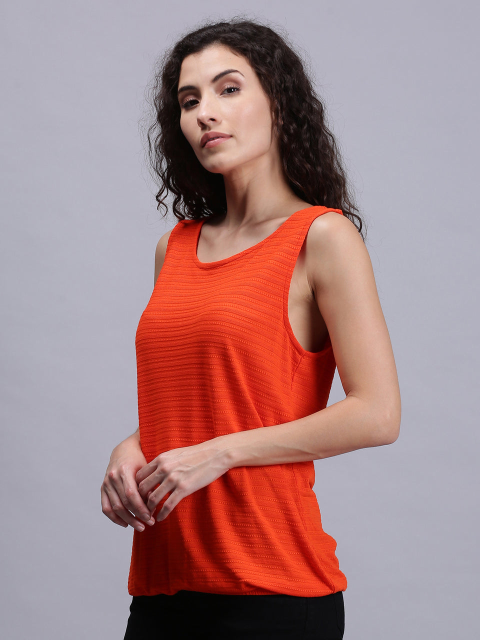 women solid orange sleeveless tank tops